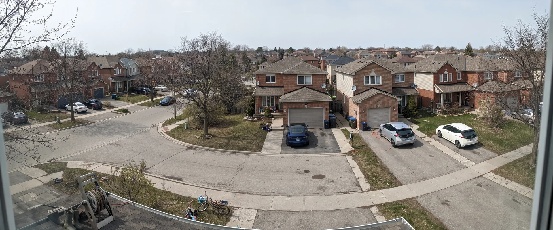 Greater Toronto Area homes with electric vehicles charging in driveways