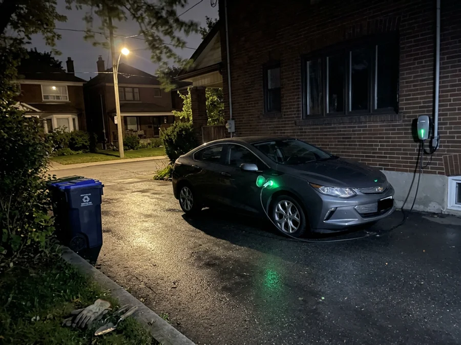 EV charging overnight on a Toronto driveway during off-peak hours