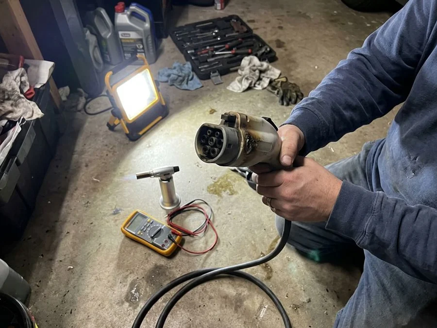 Heat-damaged EV charger connector during an after-hours safety call